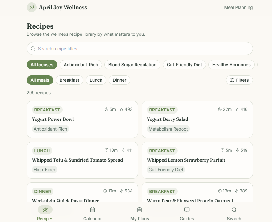 The April Joy Wellness planner recipe library: search box, focus and meal filters, a count of 299 recipes, and cards for a yogurt power bowl, yogurt berry salad, whipped tofu spread and a lemon strawberry parfait